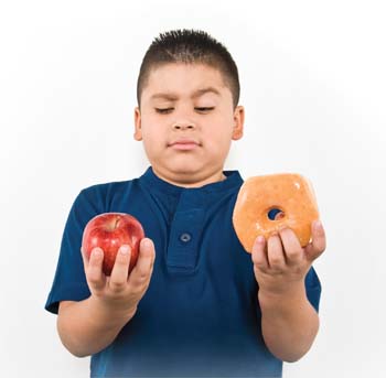 Boy deciding between an apple and a donut